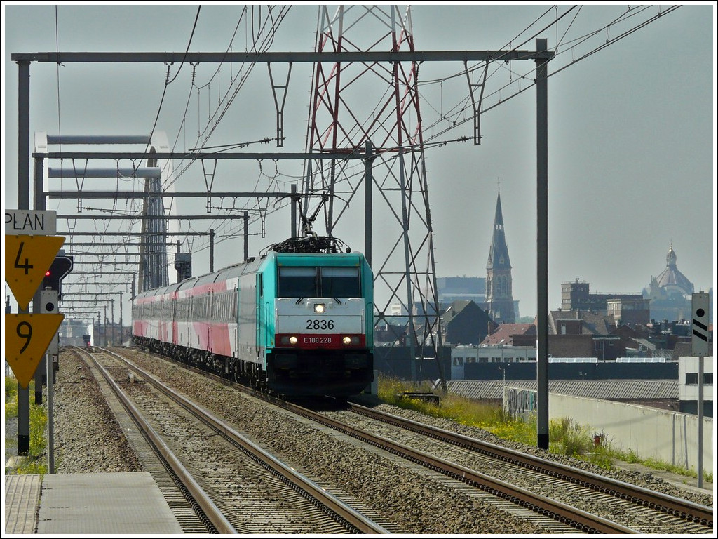 . The TRAXX HLE 2836 is hauling the IC Brussels - Amsterdam through the station Antwerpen-Luchtbal on June 23rd, 2010.