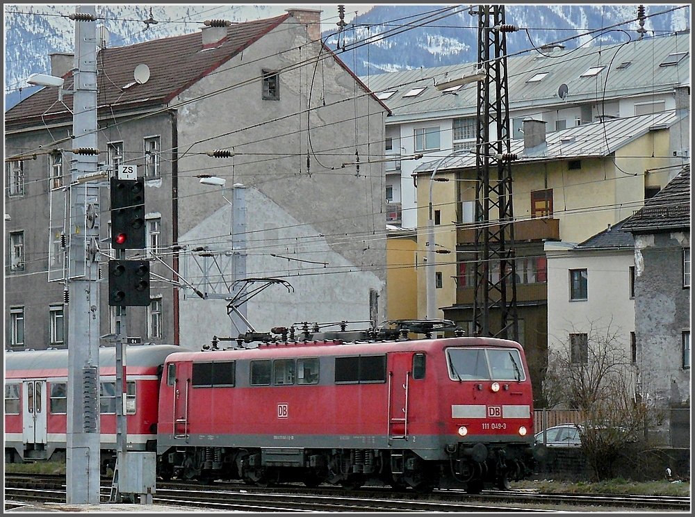 111 049-3 is arriving at the main station of Innsbruck on December 22nd, 2009.