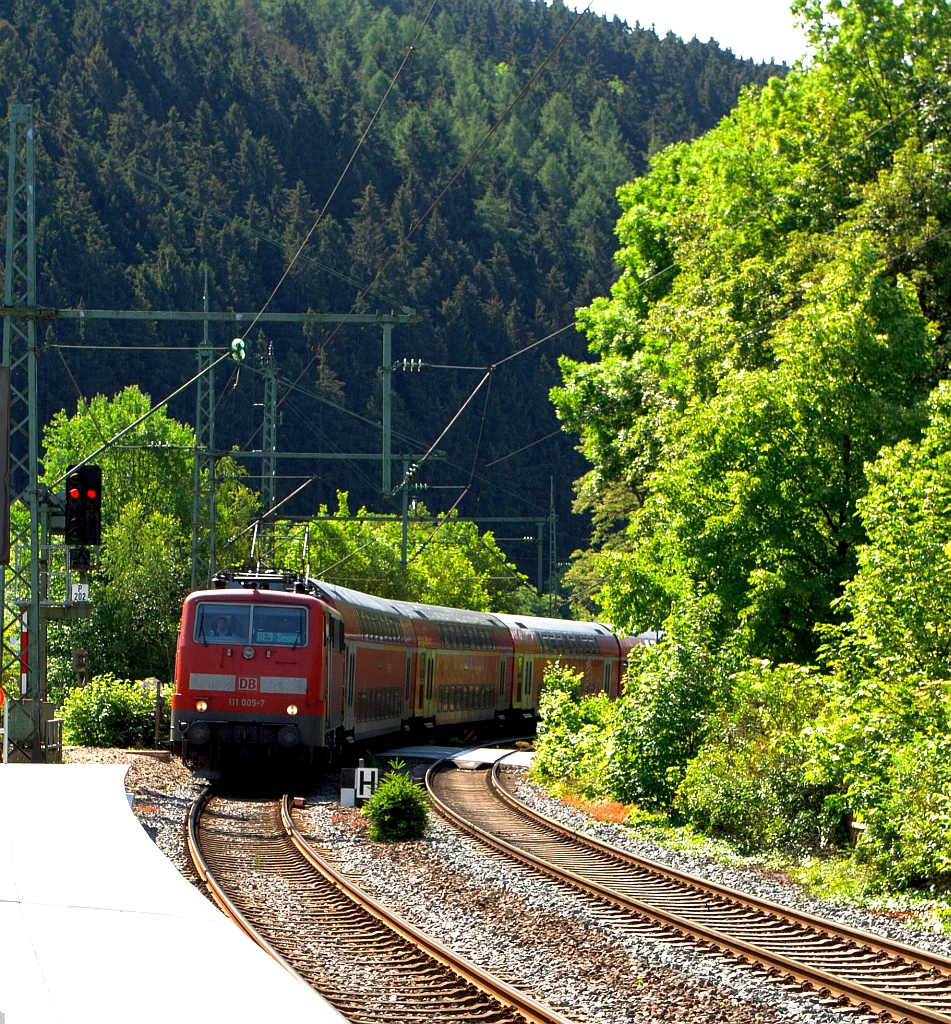 111009-7 with RE 9 Rhein-Sieg-Express (Aachen-Cologne-Siegen) just before the entrance to the station Kirchen/Sieg on 03.06.2011.