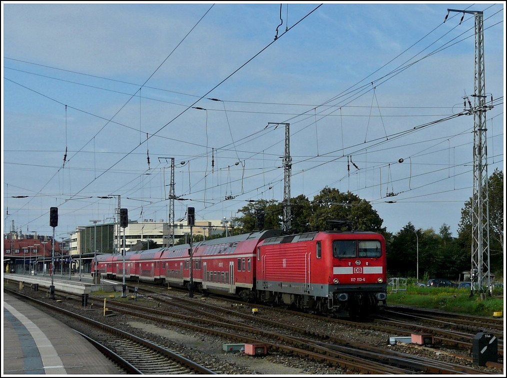 112 113-6 is leaving the station of Stralsund on September 20th, 2011.