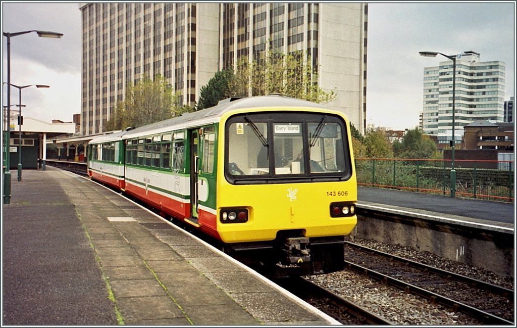 143 606 to Barry Island is leaving Cardiff Queen Street Station. 
November 2000  
(Analog Picture from CD)
