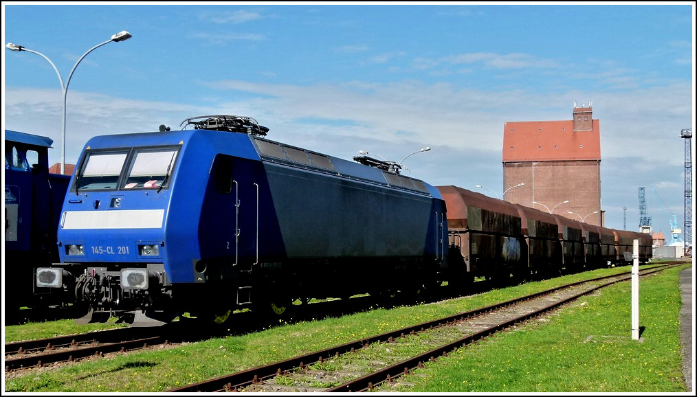 145-CL 201 is heading some goods wagons in the harbour of Stralsund on September 20th, 2011.