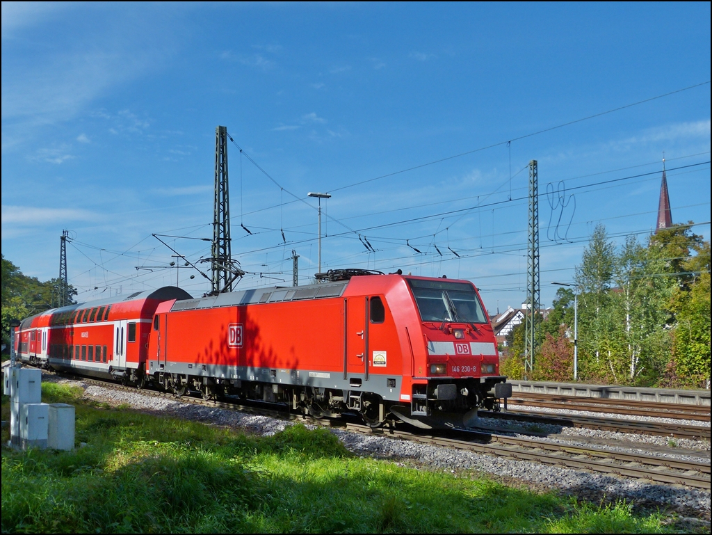 146 230-8 is hauling a Black Forest railway (Schwarzwaldbahn) out of the station of Radolfzell on September 17th, 2012.