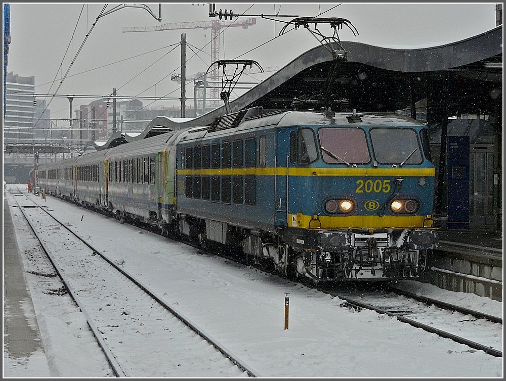 2005 with SNCF wagons is waiting for the departure to Brussels in the snowy station of Luxembourg City on December 21th, 2009.