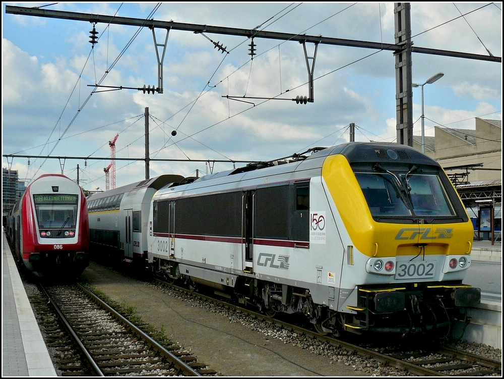 3002 with bilevel cars is waiting for passengers at the station of Luxembourg City on June 22nd, 2009.