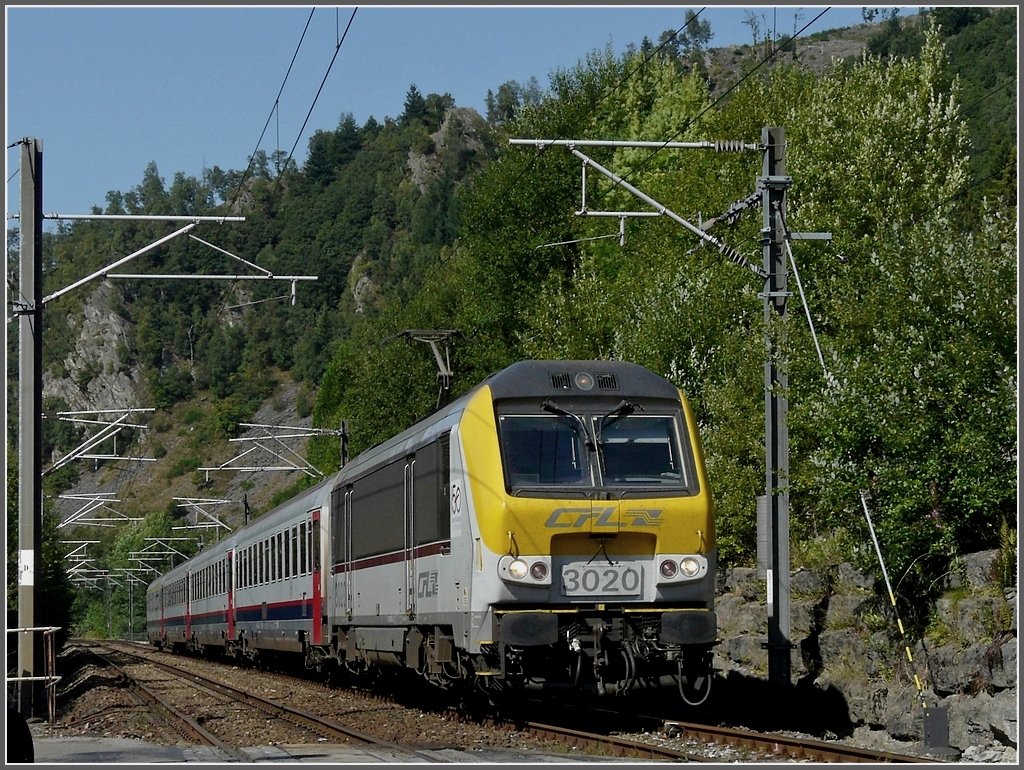 3020 hauling SNCB I 6 wagons on its way from Liers to Luxemburg City photographed in Salmchteau (B) on August 6th, 2009.