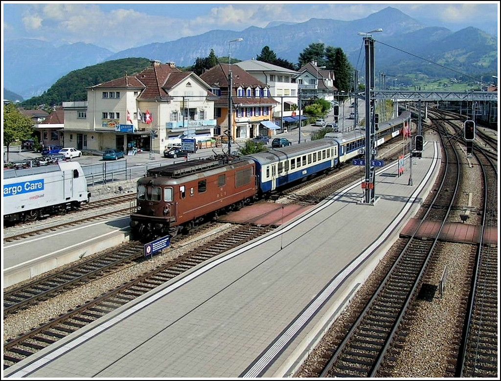A BLS Re 4/4 is pushing a local train to Interlaken out of the station of Spiez on August 6th, 2007. 
