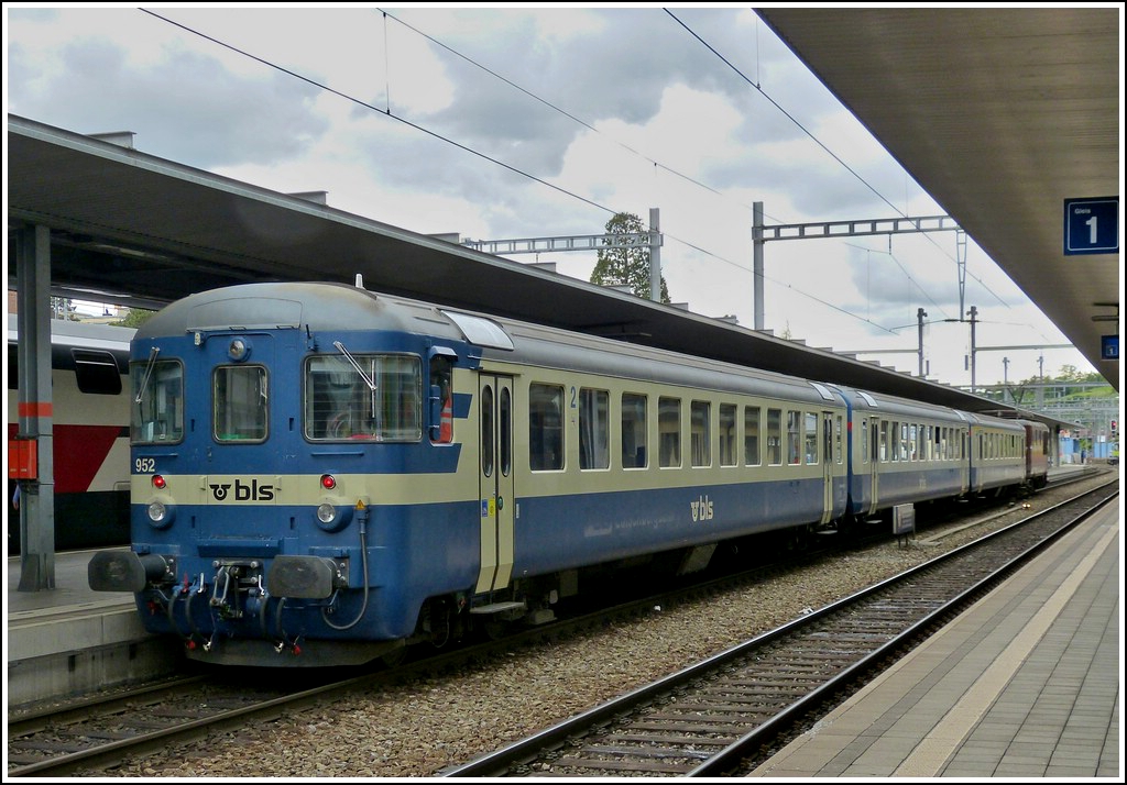 A local train from Interlaken is entering into the station of Spiez on May 22nd, 2012.