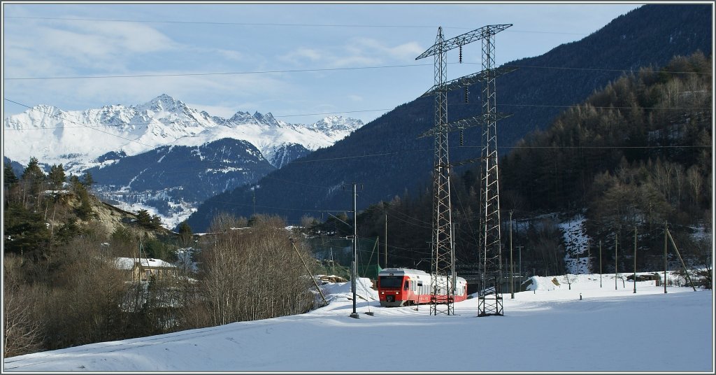A M-O (TMR) local train on the way to Martigny just after Sembrancher. In the background Verbier in the Ski Area 4-Valle.
27. 01.2013
