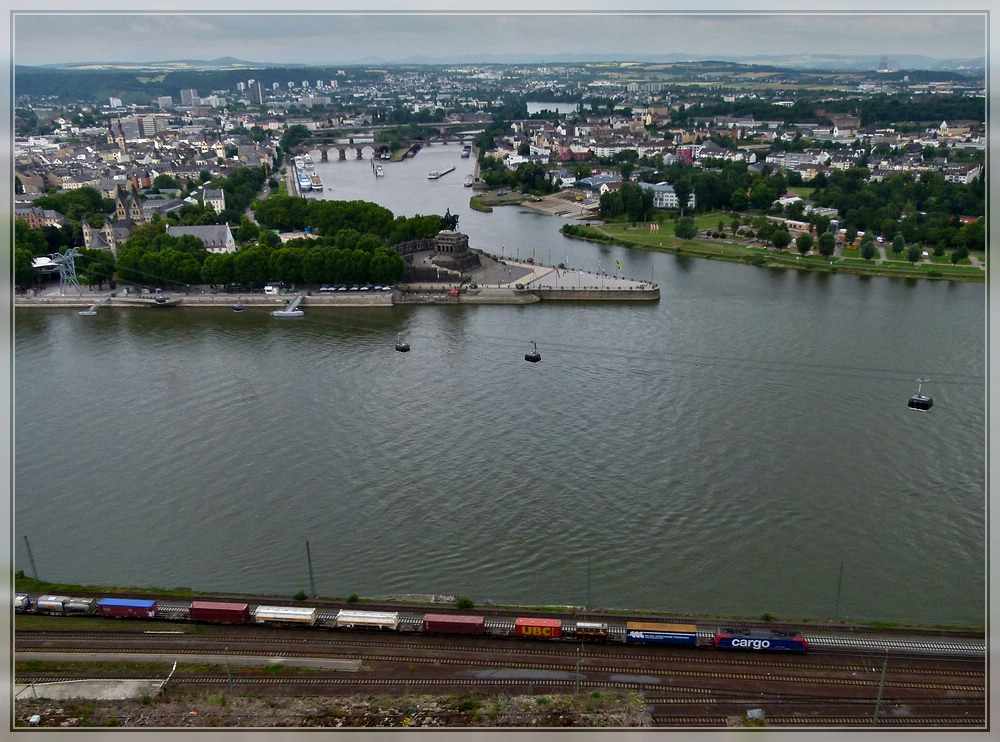 A SBB Cargo Re 482 is hauling a goods train through Koblenz Ehrenbreitstein on June 24th, 2011.