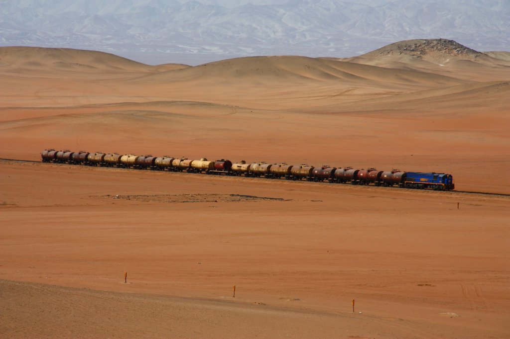 coming down from the Altiplano and the city of Arequipa, Perurail 752 rolls through the desert before the final descend down to sea level at Mollendo