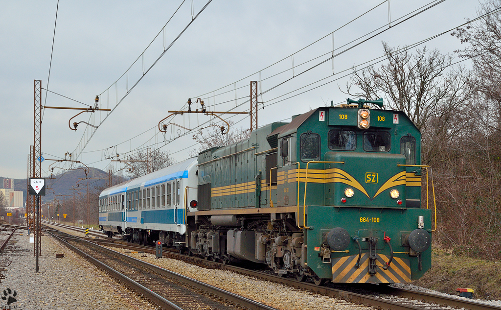 Diesel loc 664-108 pull passenger train through Maribor-Tabor on the way to the south. /5.2.2013