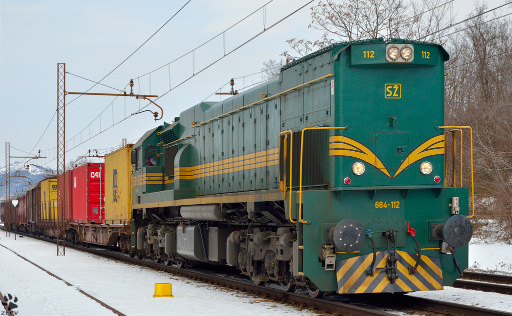 Diesel loc 664-112 pull freight train through Maribor-Tabor on the way to Tezno yard. /28.3.2013
