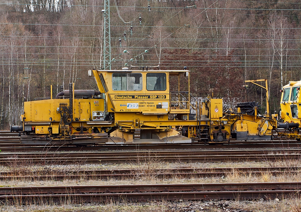 German Plasser Ballast Distributing and Profiling Machine SSP 120 SW (heavy vehicle no. 97 16 41 501 17-8) of the DGU (Deutsche Gleisbau Union), parked on 10.12.2011 in Betzdorf/Sieg.