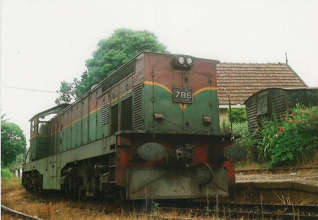 Henschel Thyssen Class M6 - 786 ready for departure out of Demodara on the way to Badulla. A discarded goods wagon ( the black color object) mount on the side of the platform  which is now been used for storage is visible in the picture.