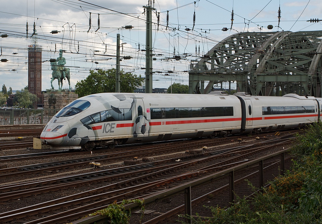 ICE 3 (403012-8)  Montabaur  in football design comes on 07.08.2011 on the Hohenzollern Bridge, and runs right into the central station in Cologne.