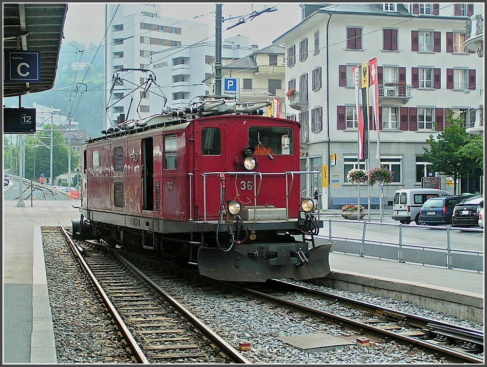MGB HGe 4/4 36 is running through the MBG station at Brig on August 7th, 2007.