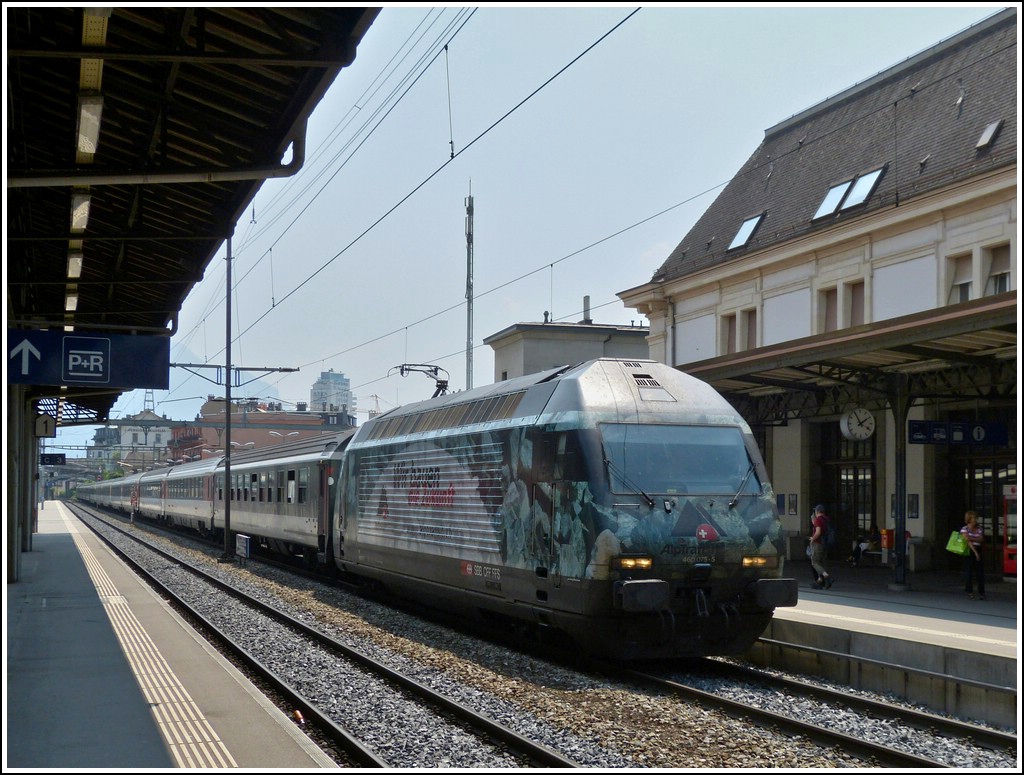Re 460 075-5 is hauling a IR Brig - Geneva into the station of Montreux on May 25th, 2012.