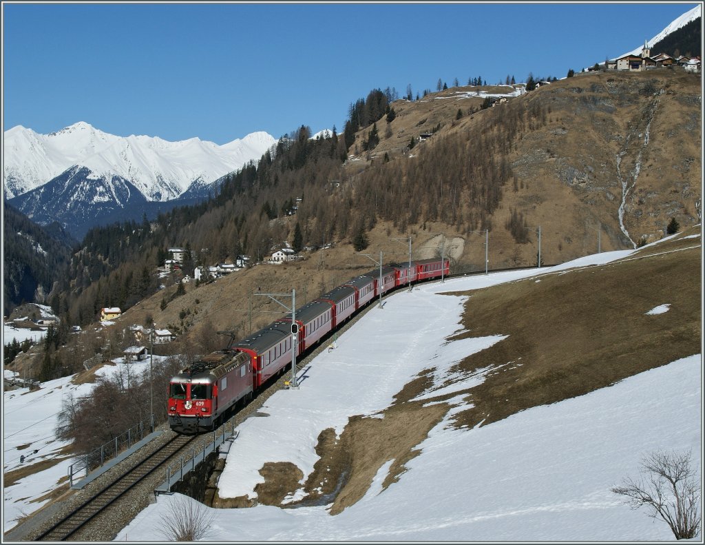 RhB Ge 4/4 II 429 with his Albula-Fast train from St Moritz to Chur over Bergn.
16.03.2013