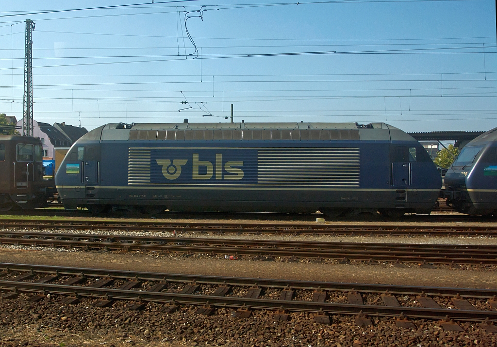 Swiss electric locomotive Re 465017-2 BLS parked on 30.09.2011 in Basel Bad Station. Photographed out of a moving ICE.