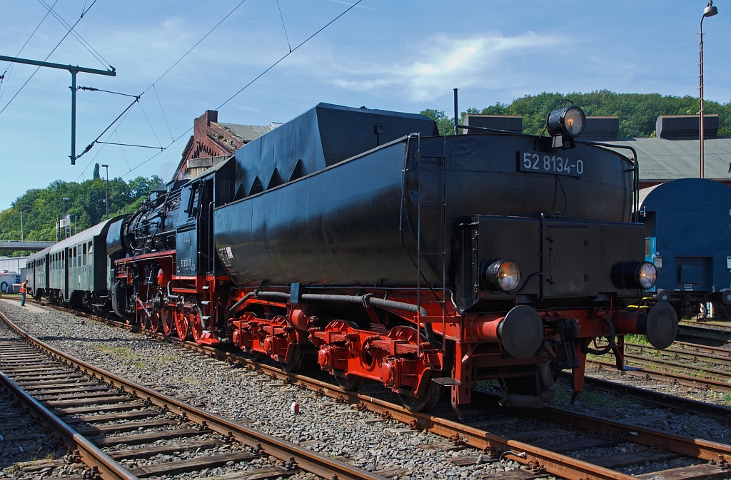 The German Steam Locomotive 52 8134-0 from the Eisenbahnfreunde Betzdorf (Railway friends Betzdorf) on 18.08.2012 in the South Westphalian Railway Museum in Siegen (Germany), the locomotive has appended her train.