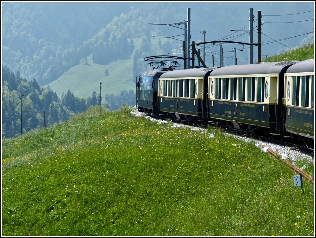 The Goldenpass classic train is running between Chteau d'Oex and Rossinire on May 25th, 2012.