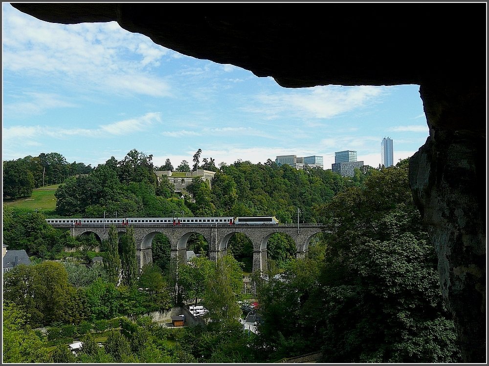 The IR Liers-Luxembourg City is crossing the Clausen bridge on August 1st, 2009. The picture was taken out of the so called casemates of the Bock, a extraorinary network of 23 km underground tunnls, which were formerly used as underground defence galleries.   