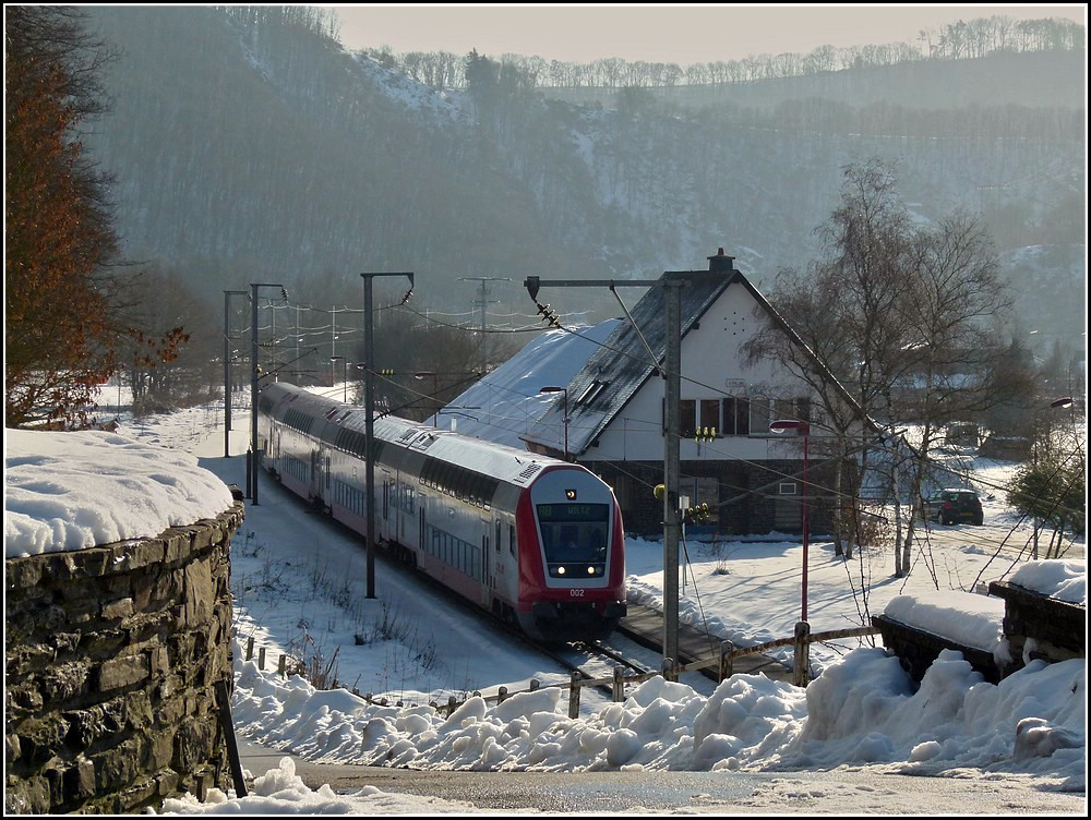 The local train RB 3211 Luxembourg City-Wiltz is leaving the station of Michelau on January 2nd, 2011.