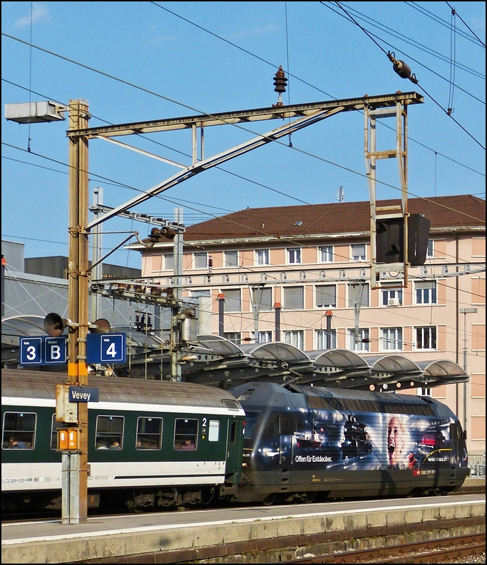 The Re 460 019-3 is leaving the station of Vevey on May 26th, 2012.