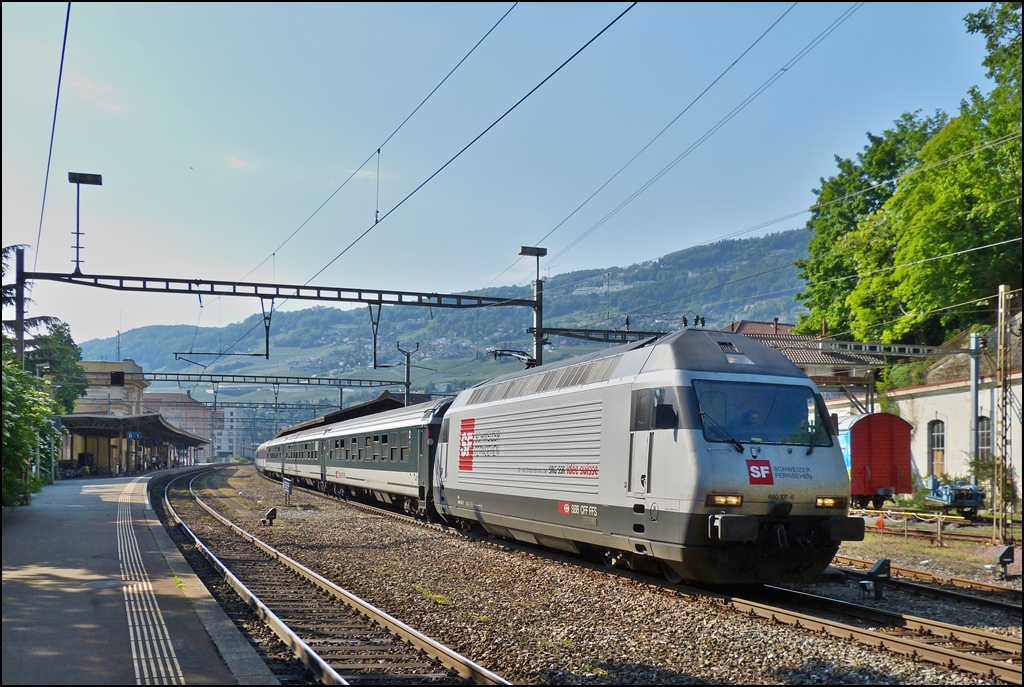 The Re 460 107-6 is hauling a IC Geneva Airport - Brig out of the station of Vevey on May 26th, 2012.