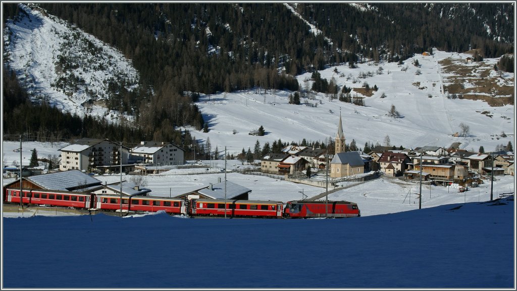 The RhB Ge 4/4 III with his RE St Moritz - Chur is approaching Bergn/Bravuogn. 
16.03.2013