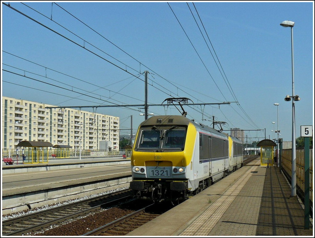 Two Srie 13 engines are running through the station Antwerpen-Luchtbal on June 23rd, 2010.