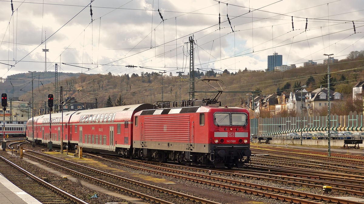 . 143 568 photographed with bilevel cars in Koblenz main station on March 2nd, 2015.