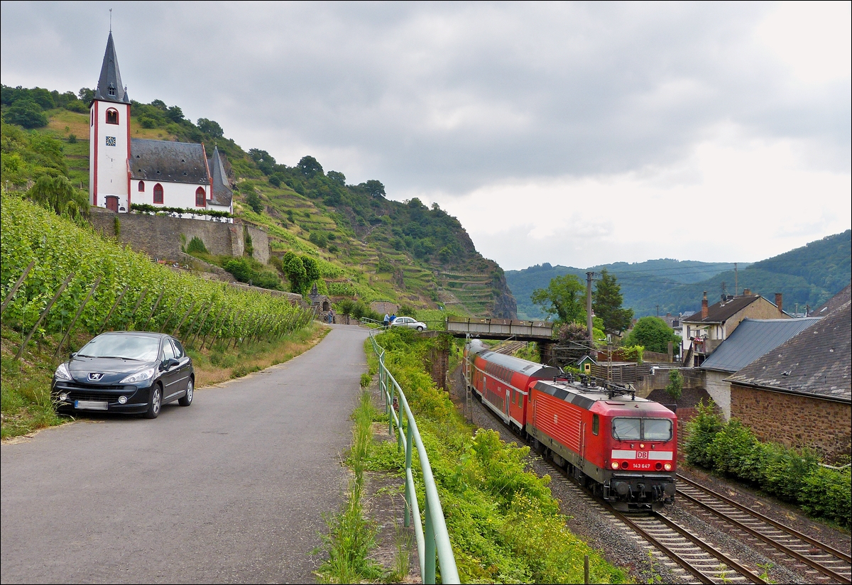 . 143 647 is hauling a RE 1 (Mosel-Saar-Express) Koblenz - Saarbrcken through Hatzenport on June 21sr, 2014.