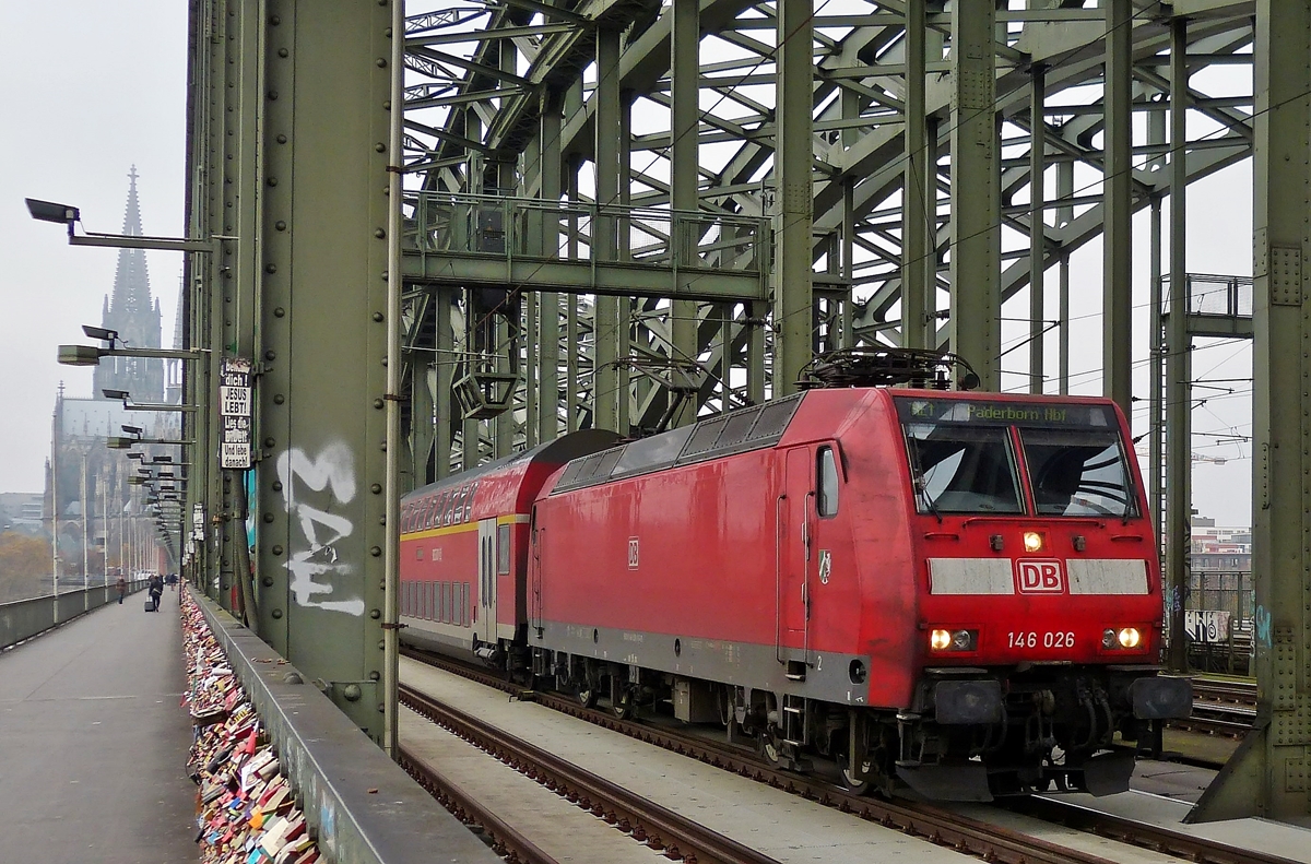 . 146 026 is hauling the Re 1 to Paderborn main station over the Hohenzollernbrcke in Cologne on November 20th, 2014.