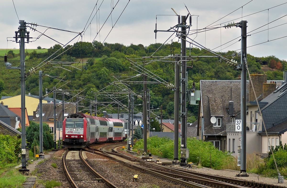 . 4012 is hauling a local train from Trier into the station of Wasserbillig on August 30th, 2014.