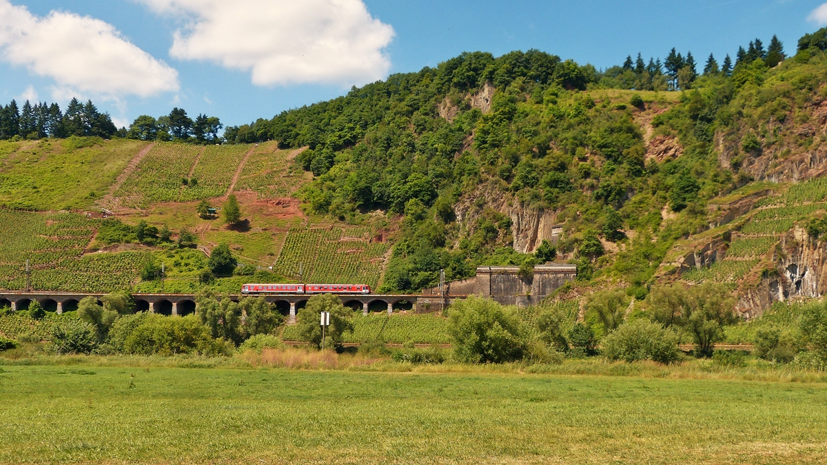 . A local train from Traben-Trarbach is running on the slope viaduct near Pnderich on June 21st, 2014.