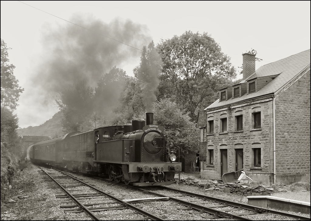 . A steam train is arriving in the station Dorinne-Durnal on the heritage railway track Le Chemin de Fer du Bocq on August 17th, 2013.