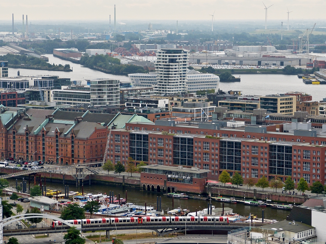 . A train of Hamburger Hochbahn is running on the Binnenhafenbrcke between the stops Rdingsmarkt and Baumwall on the U 3 in Hamburg. The picture was taken from the tower of St Michaelis church on September 21st, 2013.