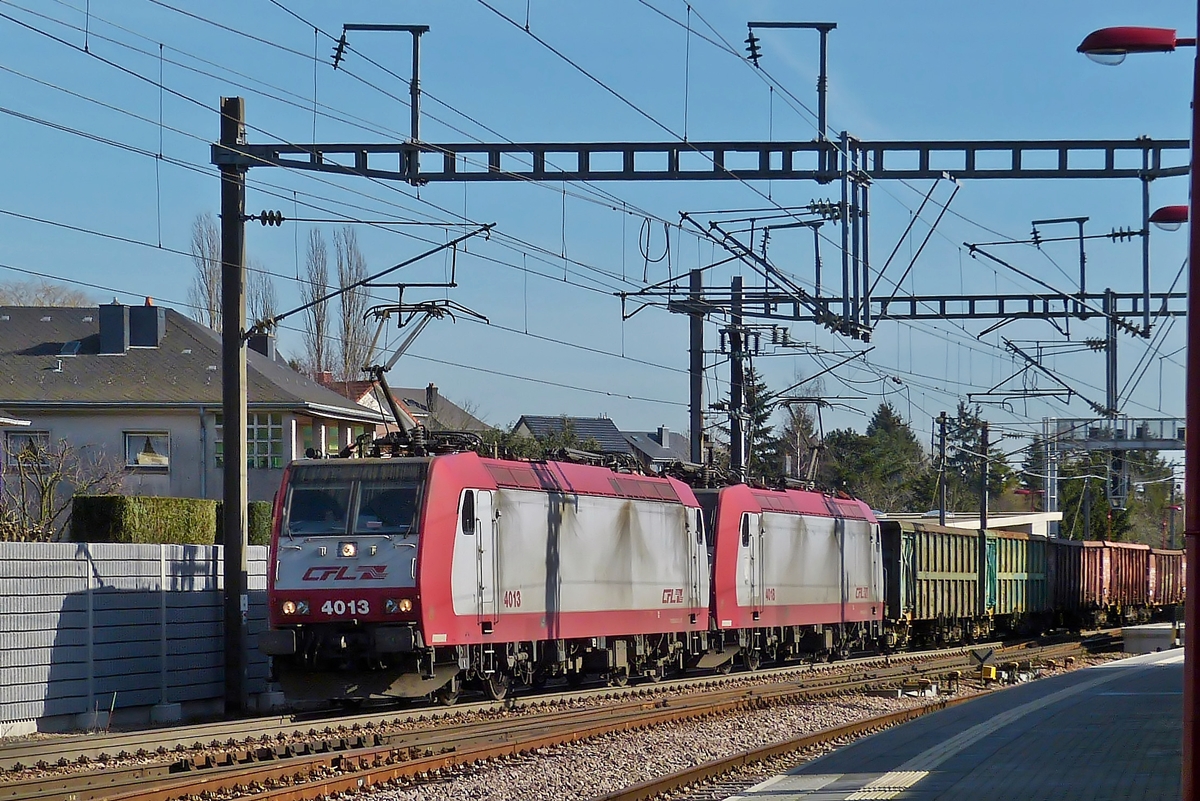 . Srie 4000 double header (4013 and 4016) is hauling a freight train through the station of Noertzange on February 24th, 2014.