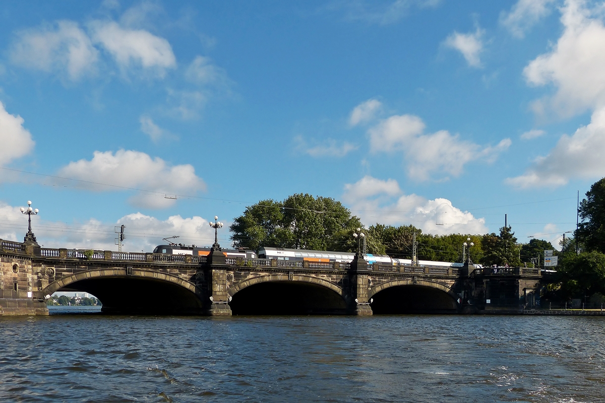 . The Lombardsbrcke in Hamburg with a HKX train running on it taken during a boat sightseeing tour on the Alster on September 19th, 2013.