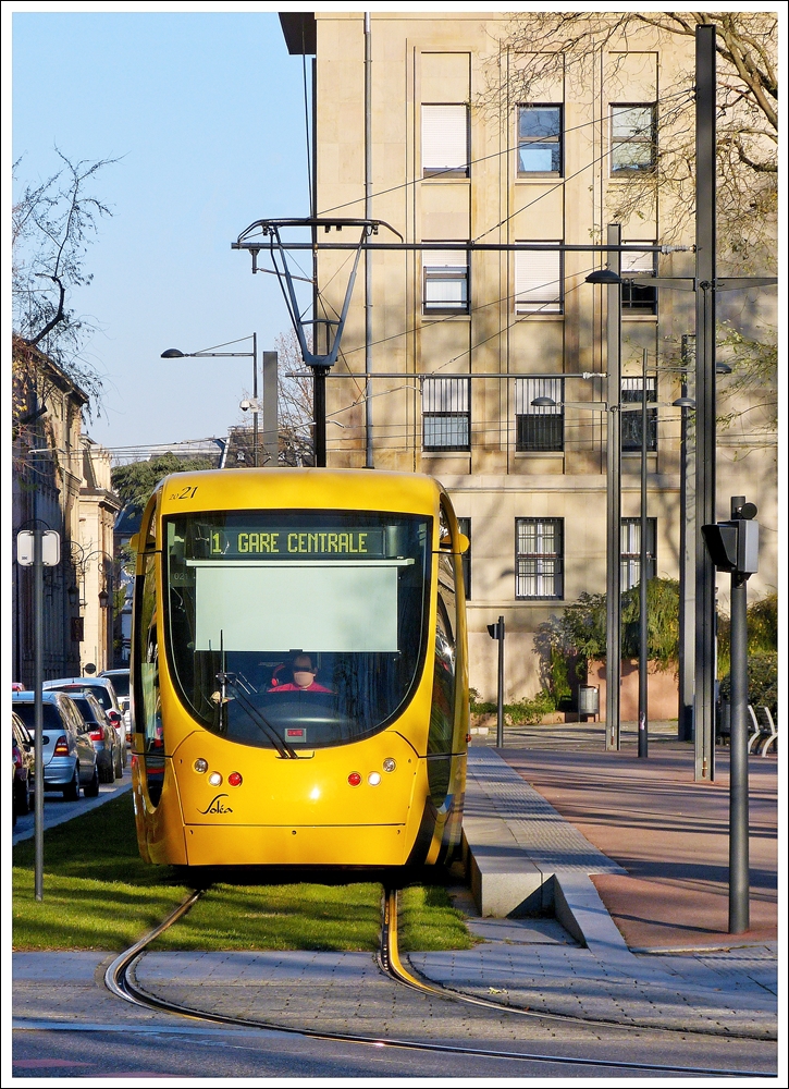 . The Sola tram N 2021 is running through Rue du 17 Novembre in Mulhouse on December 10th, 2013.