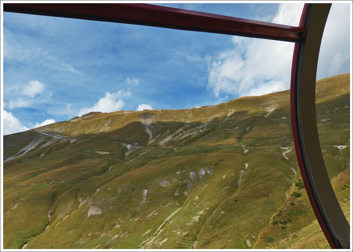 . The superb BRB track with the Schonegg galerie and the summit station Rothorn Kulm seen out of the running train on September 27th, 2013.
