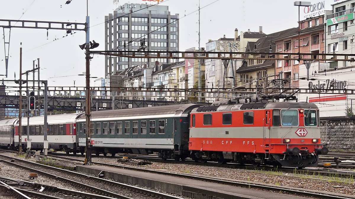 . The Swiss Express Re 4/4 II 11108 is entering into the station Basel SBB on August 4th, 2008.