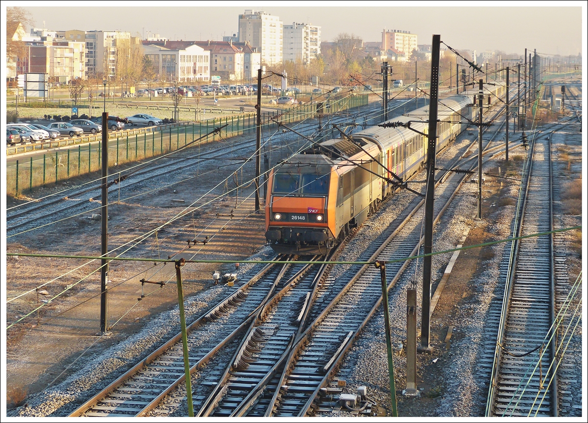 . The Sybic BB 26148 is hauling the TER 96218 Ble - Strasbourg into the main station of Mulhouse on December 11th, 2013.