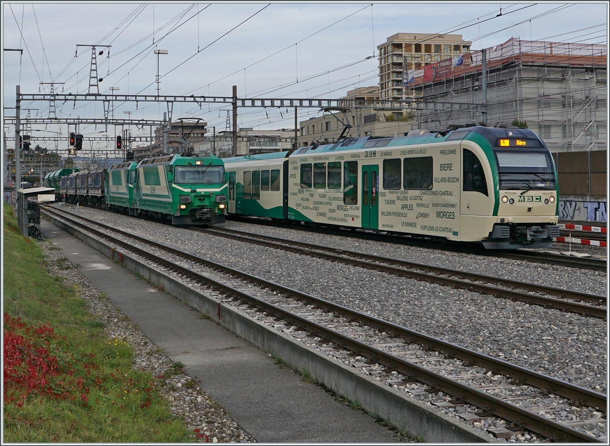 A BAM local Service is leaving Morges on the way to Biere, in the background stand the Ge 4/4 21 and 22. 

18.10.2021