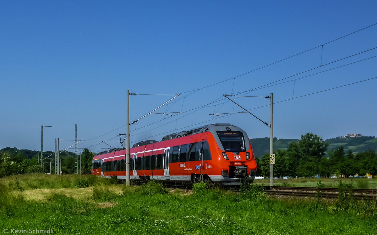 A regional express train with emu series 442 106, called 'Talent 2', is on the ride from Jena to Nuremberg near Kahla, Thuringia, with its famous 'Leuchtenburg' in the background. (19 June 2013)
