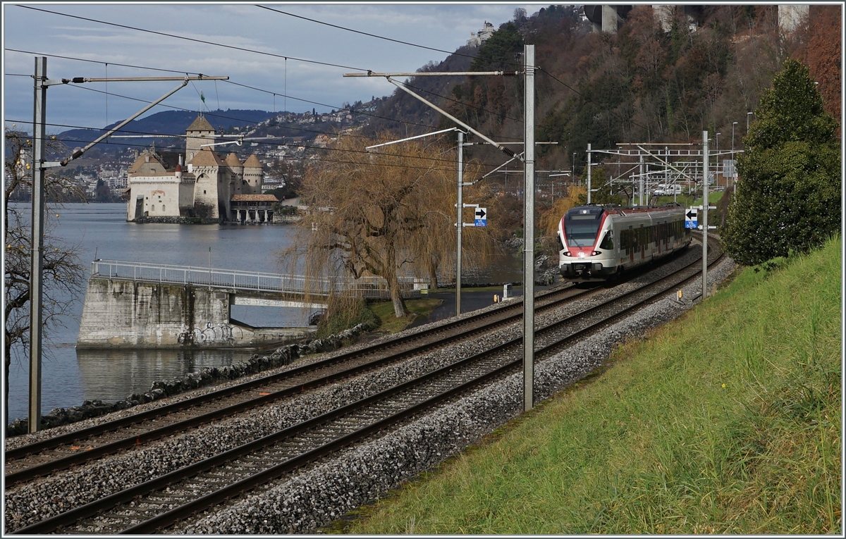 A SBB Flirt RABe 523 on the way to Lausanne and the castle of Chillon by a very short sunny-time this day.

04.01.2022