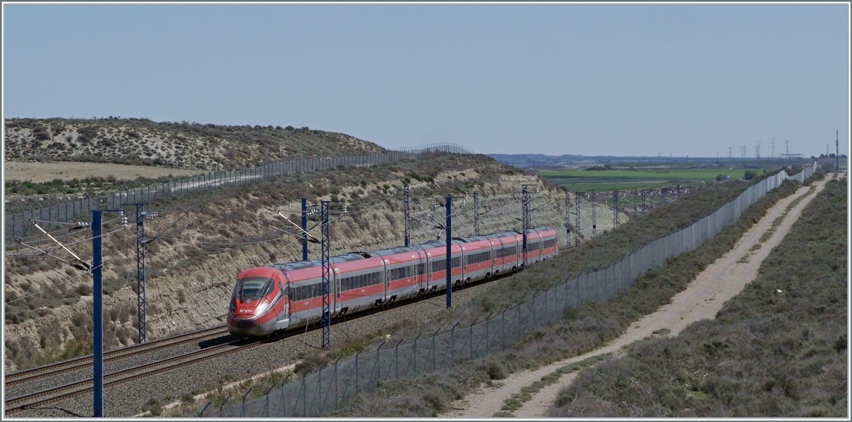  Bella Italia  in the middle of Spain and very quickly: the IRYO ETR 400 flies from Madrid   at around 300 km/h to Barcelona via the high-speed line near Bujaraloz (Spain). This is the IRYO Service 6011. 

April 6, 2024