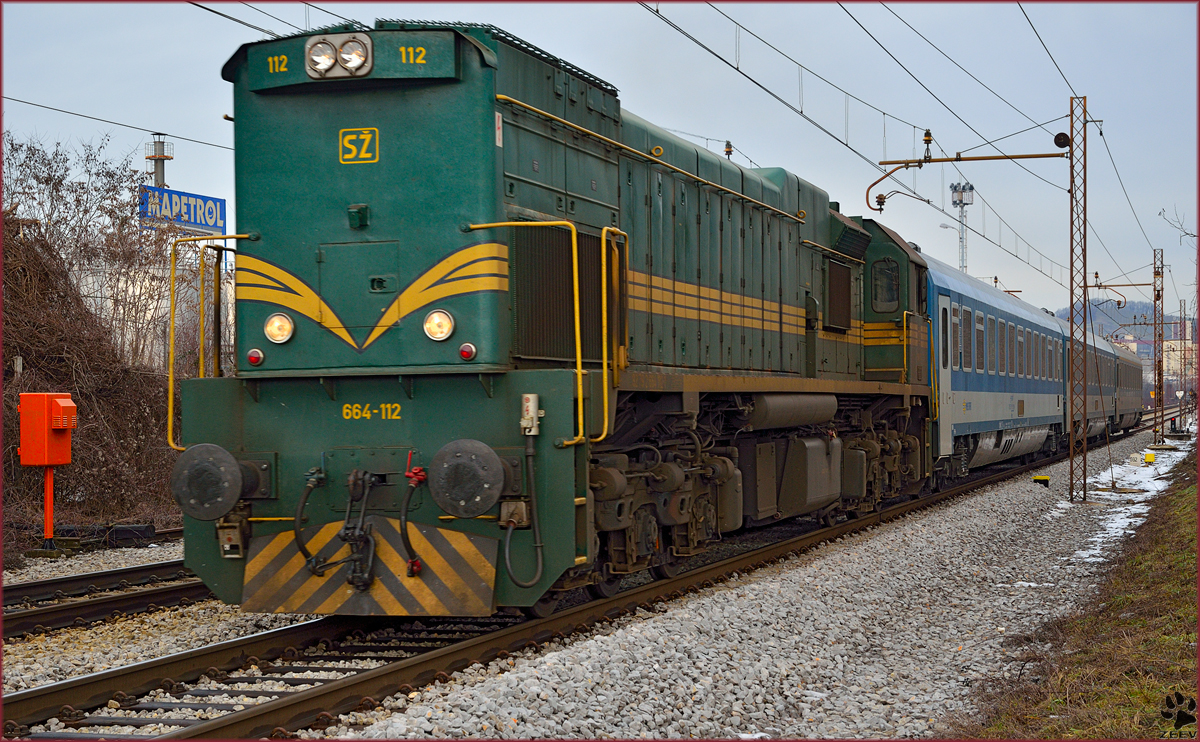 Diesel loc 664-112 is hauling MV247 'Citadella' through Maribor-Tabor on the way to Budapest. /10.2.2014